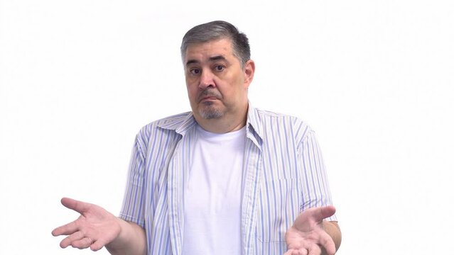 Middle-aged man expressing confusion, gesturing with hands to show lack of understanding. Isolated on a white background.