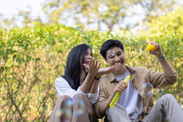 Obraz premium Lesbian couple sharing romantic love and care in public, celebrating joyful union as life partners.