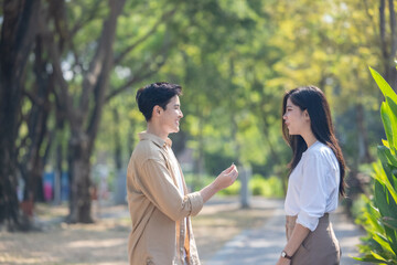 Fototapeta premium Lesbian couple sharing romantic love and care in public, celebrating joyful union as life partners.