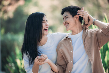 Lesbian couple sharing romantic love and care in public, celebrating joyful union as life partners.