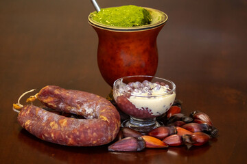 Typical Gaucho culture, yerba mate mate, red wine sago, pine nuts and rustic colonial salami