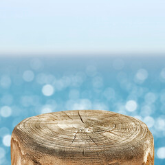 Wooden pedestal of empty space for your decoration and hot summer day. Landscape of sea and beach 