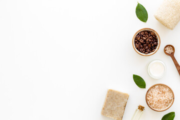 Organic care cosmetics set with coffee scrub and sea salt, top view