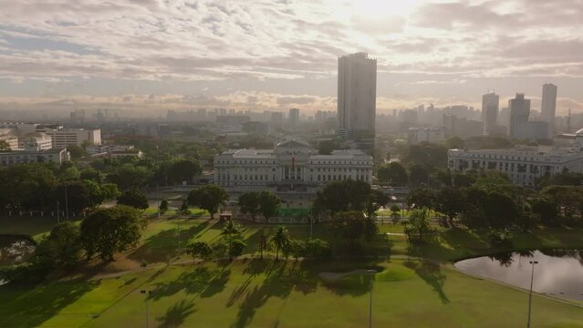 Aerial view of Manila National Museum of Fine Arts at sunrise, featuring its iconic building, greenery, and cityscape. Urban, travel, and tourism concepts