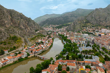 Fascinating view of the city of Amasya, also known as the city of princes. wonderful clouds coming out of the mountains. YESILIRMAK river.