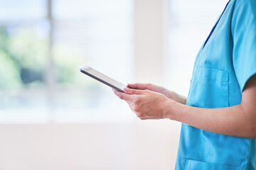 Medical Professional Using Digital Tablet in Healthcare Setting