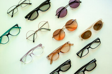 Flat lay of eyeglasses with different lenses, top view. Eyes healthcare concept