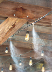 Water spray system for cooling the terrace on a hot summer day. Fogging system, high pressure water...