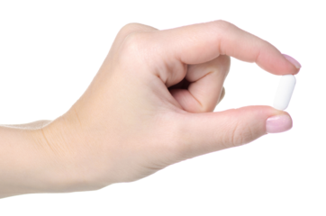 One white pill in hand pharmacy health on white background isolation