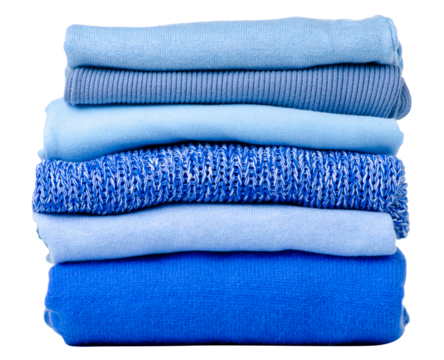 Stack folded blue sweaters on white background isolation