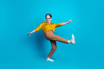 Full length photo of adorable good mood lady dressed shirt eyewear having fun empty space isolated blue color background