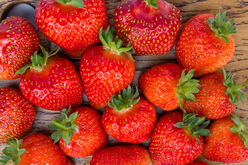 fresh strawberries on a wooden background