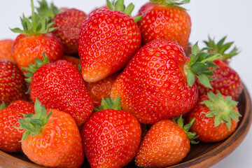 fresh strawberries on a clay plate