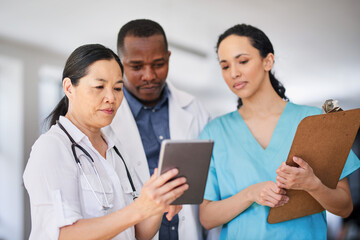 Multi-Ethnic Medical Team Collaborating in Hospital Setting