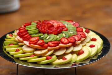 Shallow depth of field (selective focus) details with a fruit salad at a buffet.