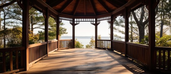 A path made of wood guides to the gazebo, offering a picturesque view with copy space image.