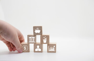 finger pinch money coin icon on wood cube for saving in bank,invest in hedge fund ,grow wealth,stock investor