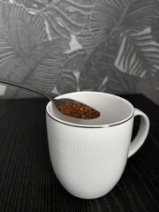 Add coffee into the empty white cup