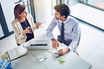 Business people, collaboration and strategy for finance with laptop in office from above with data analysis and graphs. Auditing team, financial discussion and meeting on company investment and sales