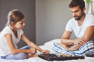 Play, child and father with checkers in home for teaching, playing and learning for childhood...