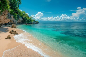 A vibrant 4K photo of a tranquil beach with smooth, golden sand, and clear, calm waters. The horizon meets a brilliant blue sky dotted with fluffy white clouds. The beach is framed by rocky cliffs on