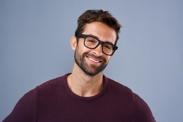 Studio, glasses and man with eye care, portrait and wellness with smile, product and lens for...