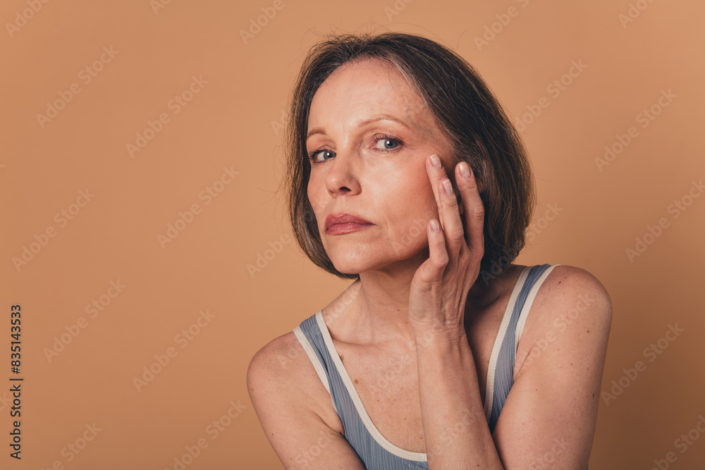 Sticker No filter photo of charming attractive retired woman enjoy skin face isolated on beige color background