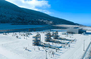 Winter landscape with natural gas filtration units at a gas metering station