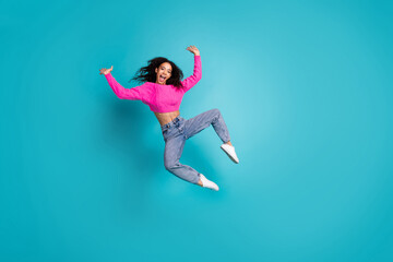 Full body photo of attractive teen girl jump have fun excited dressed stylish pink clothes isolated...