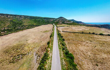 Aerial view of a long straight country road in Sardinia