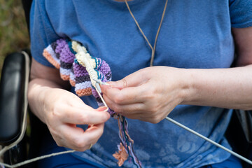 Senior woman's hands knitting