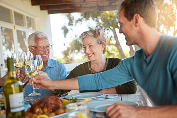 Cheers, old couple and family in backyard with wine, lunch celebration and bonding together at...