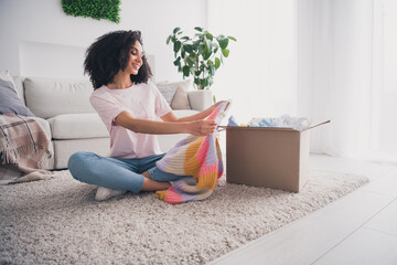 Photo of lovely dreamy cute girl wear trendy clothes sit floor unpack parcel indoors