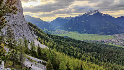 Fototapeta premium Alpine mountain landscape in spring with forest 