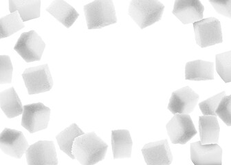 Refined sugar cubes in air on white background
