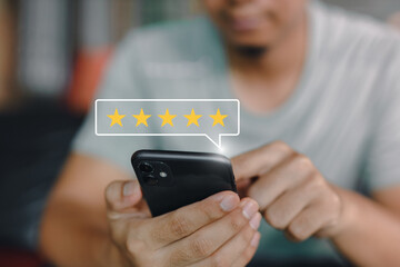 Star icon satisfaction survey, businessman finger to smartphone with five star icons, ranking of...