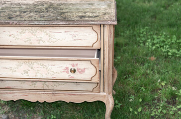 grungy though once elegant dresser