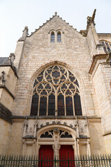 Fototapeta premium Rose window on the main portal of the church of Sainte-Marie-Madeleine of Montargis in the French department of Loiret in Burgundy, France