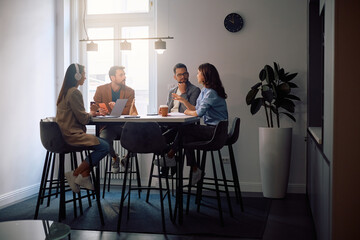 Start up team communicating during  meeting at casual office.