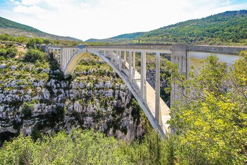 Arch bridge of Artuby above the Verdon Gorge, a river canyon located in the southern Alps near Aiguines and Trigance in France