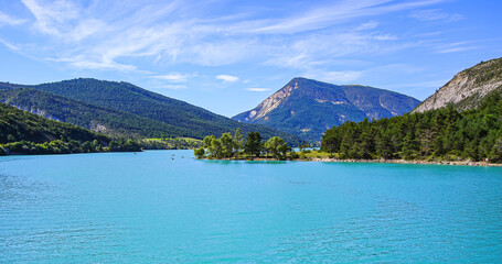 Lake of Castillon in the southern Alps in France - This reservoir with turquoise waters located in...