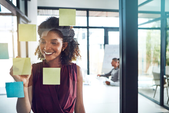 Writing, planning or happy business woman with team in office for schedule, calendar or coaching idea research. Agenda, storyboard or manager with sticky notes for training, goal or target objectives