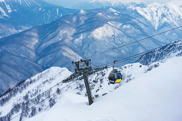Cable car way of the winter mountain ski resort.