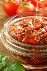 traditional Italian sun-dried tomatoes in oil with basil