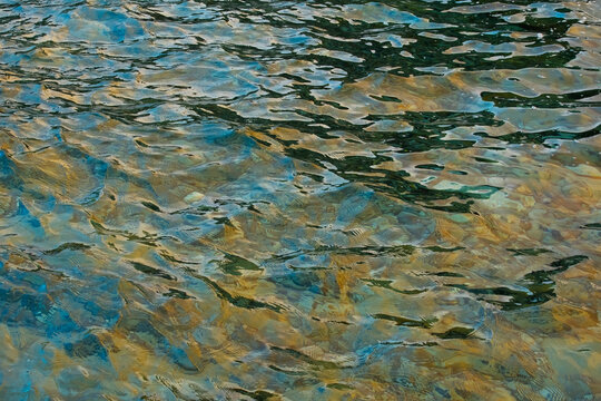 Sunlight dancing on undulating seawater surface