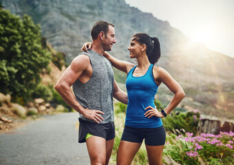 Couple, hug and fitness in nature with love, hold and exercise on mountain trail. Happy man, woman...