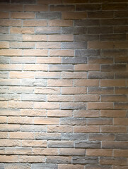 Brick wall under lighting as an abstract background. Texture