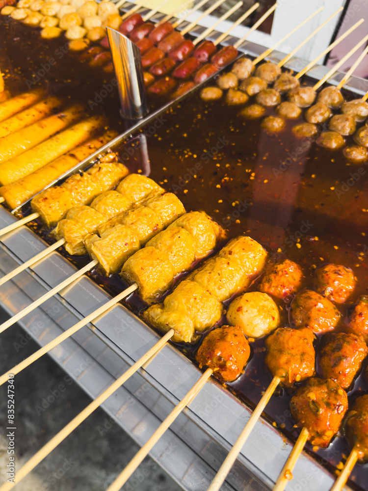 Wall mural Tofu on wooden skewers in sauce