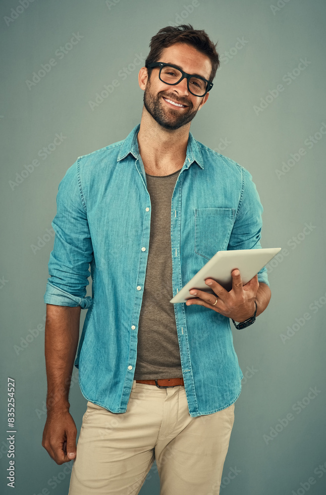Poster man, portrait and tablet by gray background with smile for social media, internet or website search.