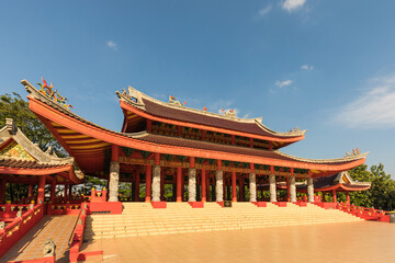 Fototapeta premium Cheng ho temple at semarang ; semarang tourism ; Majestic Traditional Chinese Architecture Under a Clear Blue Sky, Inviting Exploration and Reflection